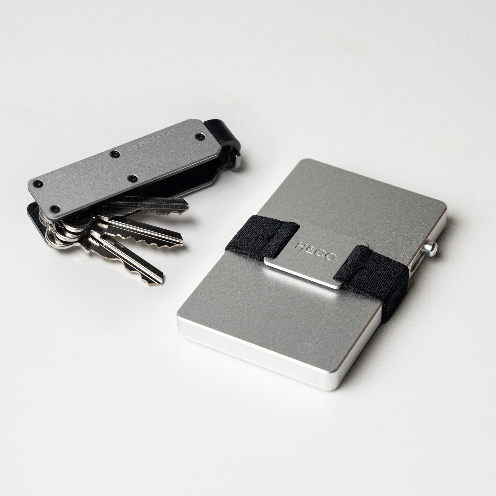 Vault Key Case in Platinum paired with Evolve Smart Wallet on white background