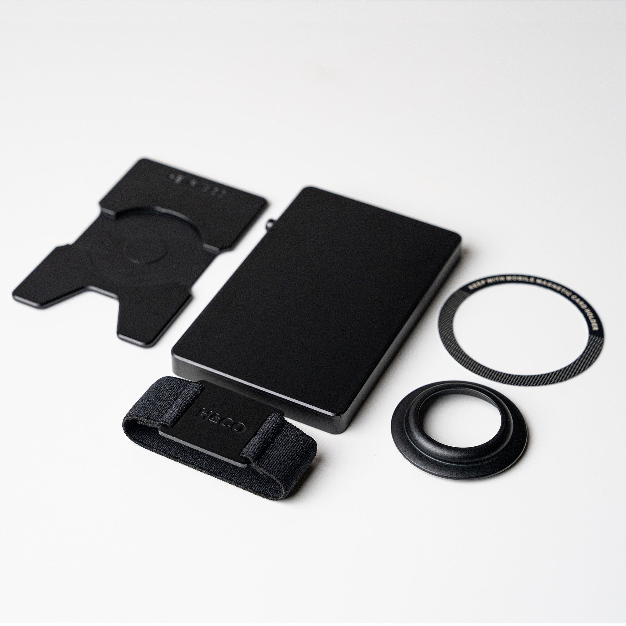Midnight Black flat lay with band, backplate and magnetic ring