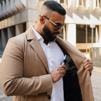 Man adjusting jacket while carrying Steel Blue wallet in front pocket