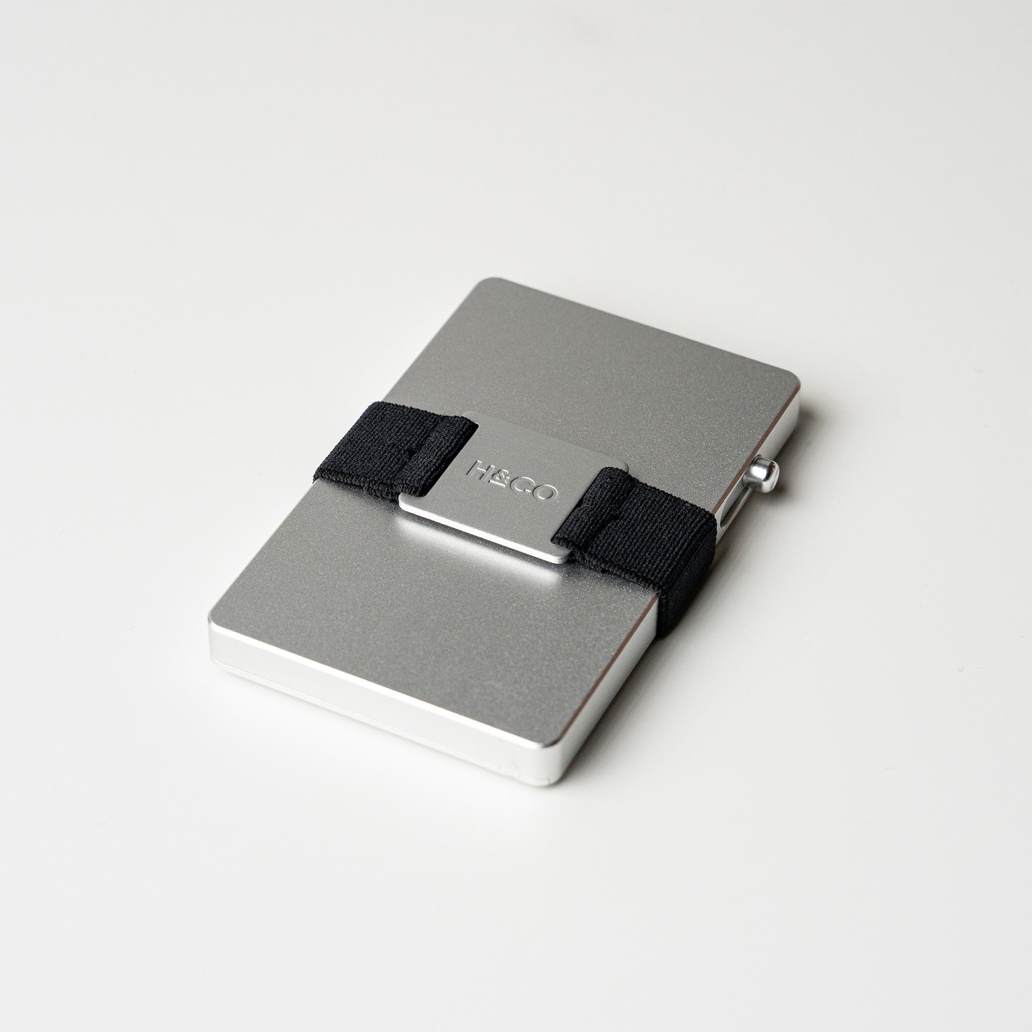 Platinum Evolve Smart Wallet standing on white surface with subtle side view