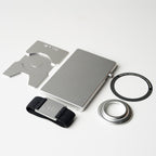 Platinum wallet with airtag holder, backplate, band and magnetic ring laid flat in bundle configuration