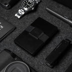 Midnight Black Vault Key Case styled with black Evolve Smart Wallet and accessories