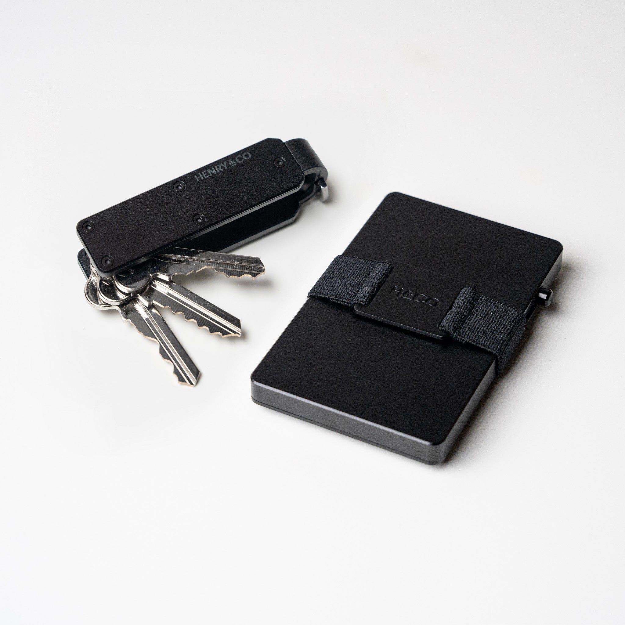 Vault Key Case in Midnight Black paired with Evolve Smart Wallet on white background
