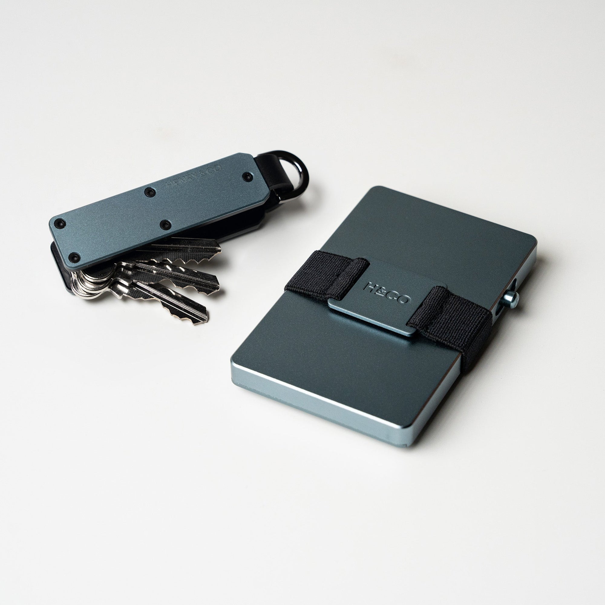 Vault Key Case in Steel Blue with screws visible on light background