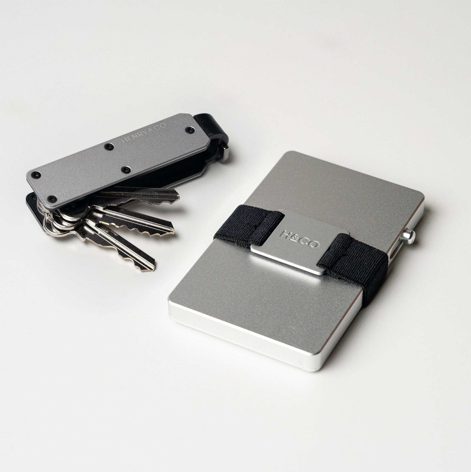 Vault Key Case in Platinum paired with Evolve Smart Wallet on white background