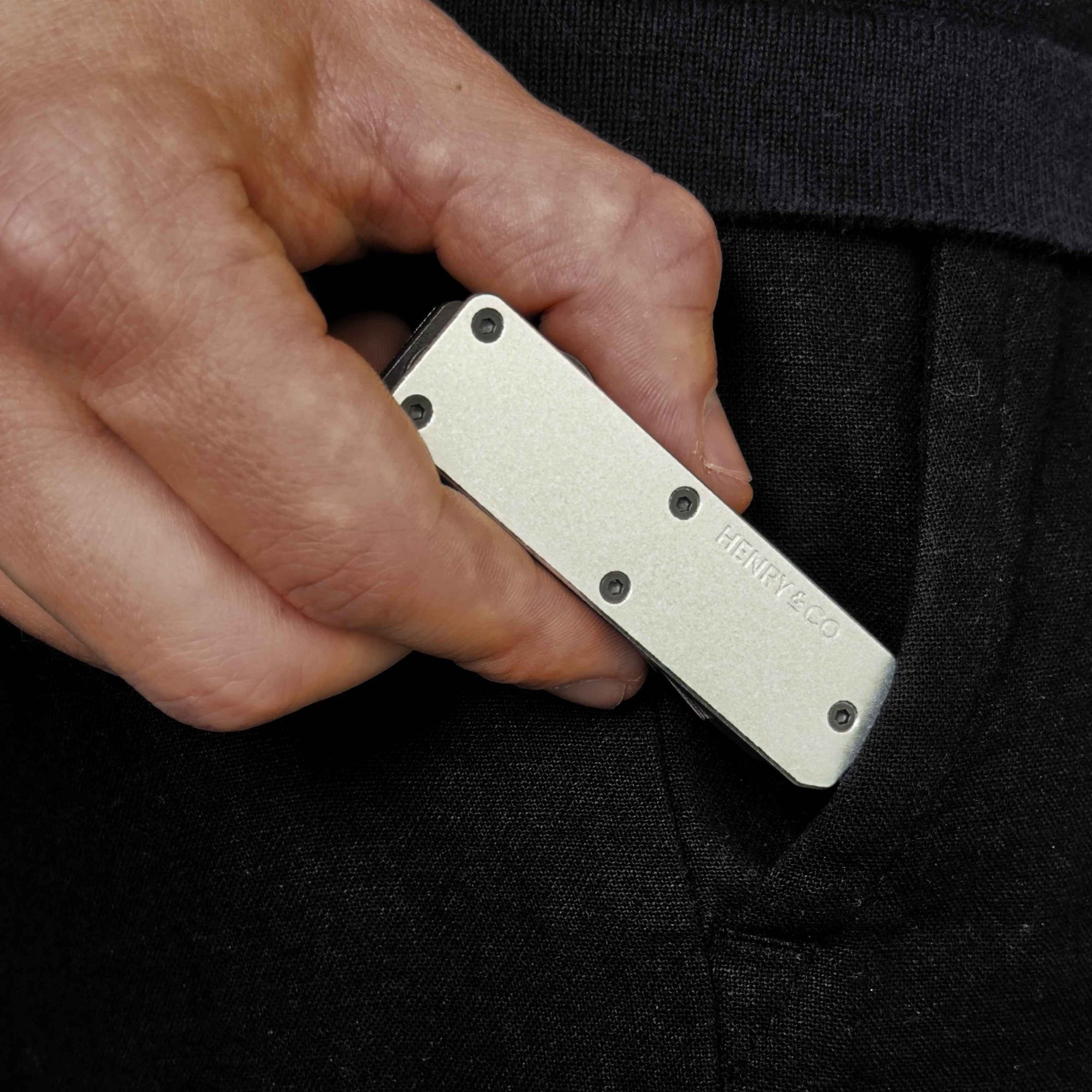 Platinum Vault Key Case lifestyle image sliding into pants pocket