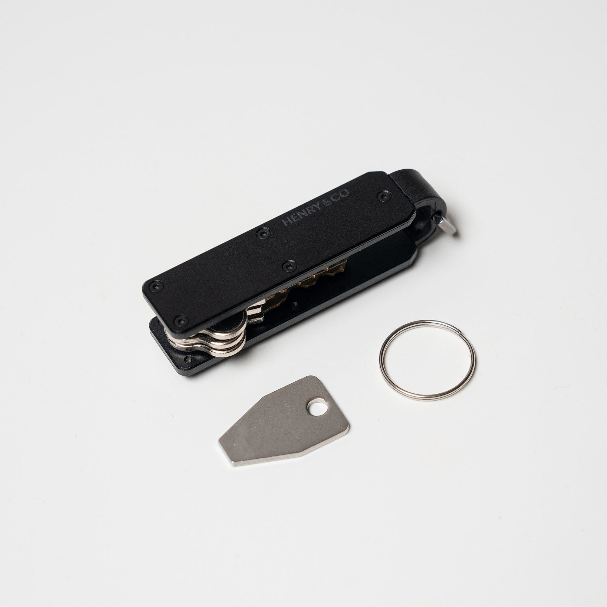 Midnight Black Vault Key Case flatlay with accessories on white background