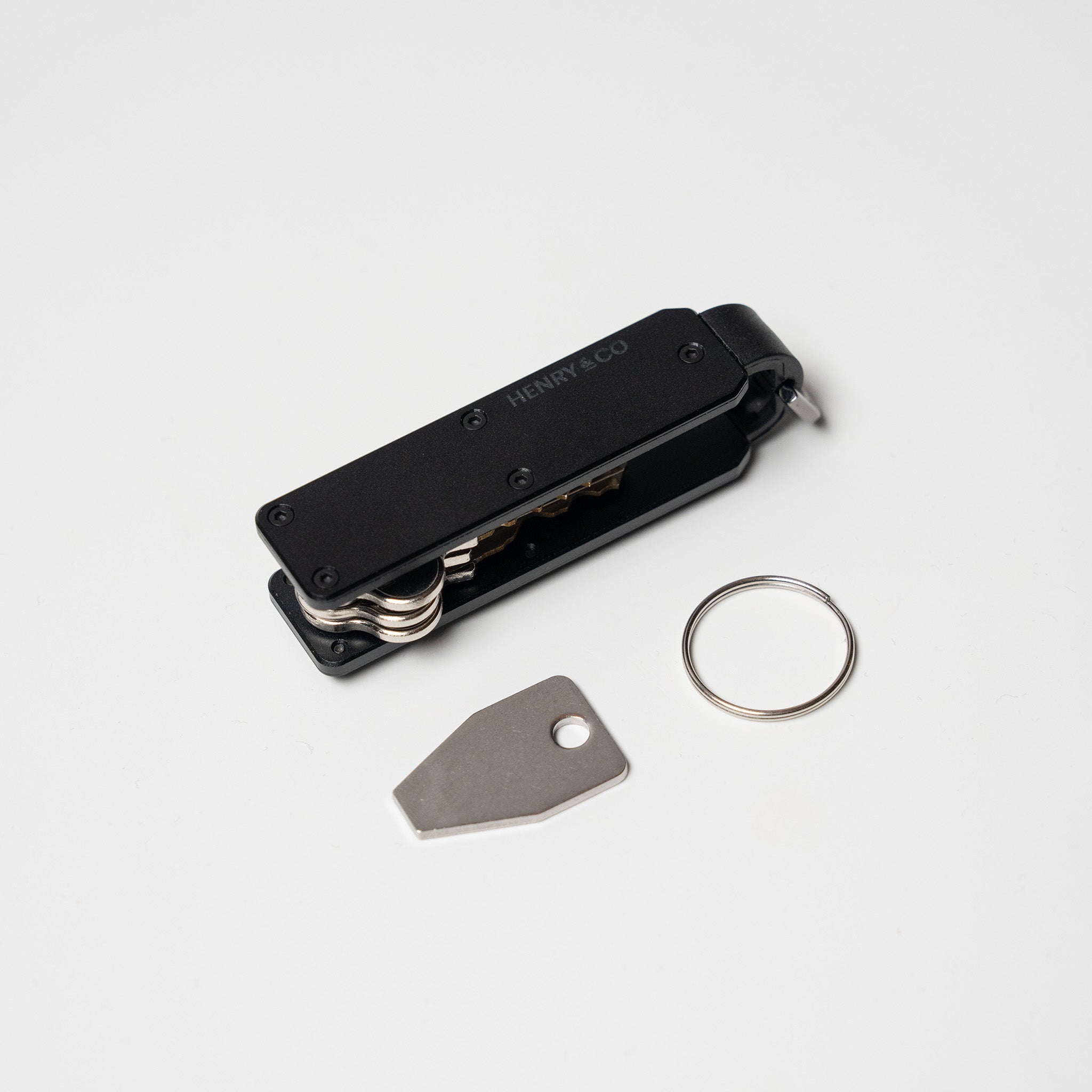 Midnight Black Vault Key Case flatlay with accessories on white background